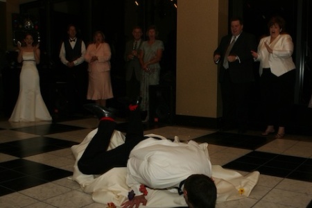 Vincent face down in a faux wedding cake, all for the amusement of his lovely bride.  Photo courtesy Jessica Belf Vincent